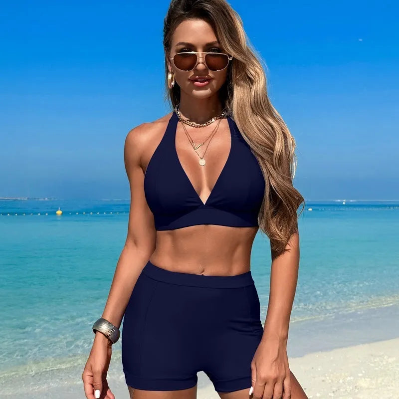 Women's black nylon bikini swimsuit with polyester lining, shown on model