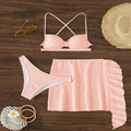 Women's lace-up bikini three-piece swimsuit set in light pink with swimsuit top, tie pants, and coordinating skirt