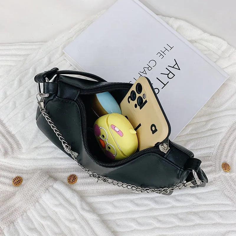 Black butterfly chain underarm bag with crossbody strap showing internal mobile phone and document compartments