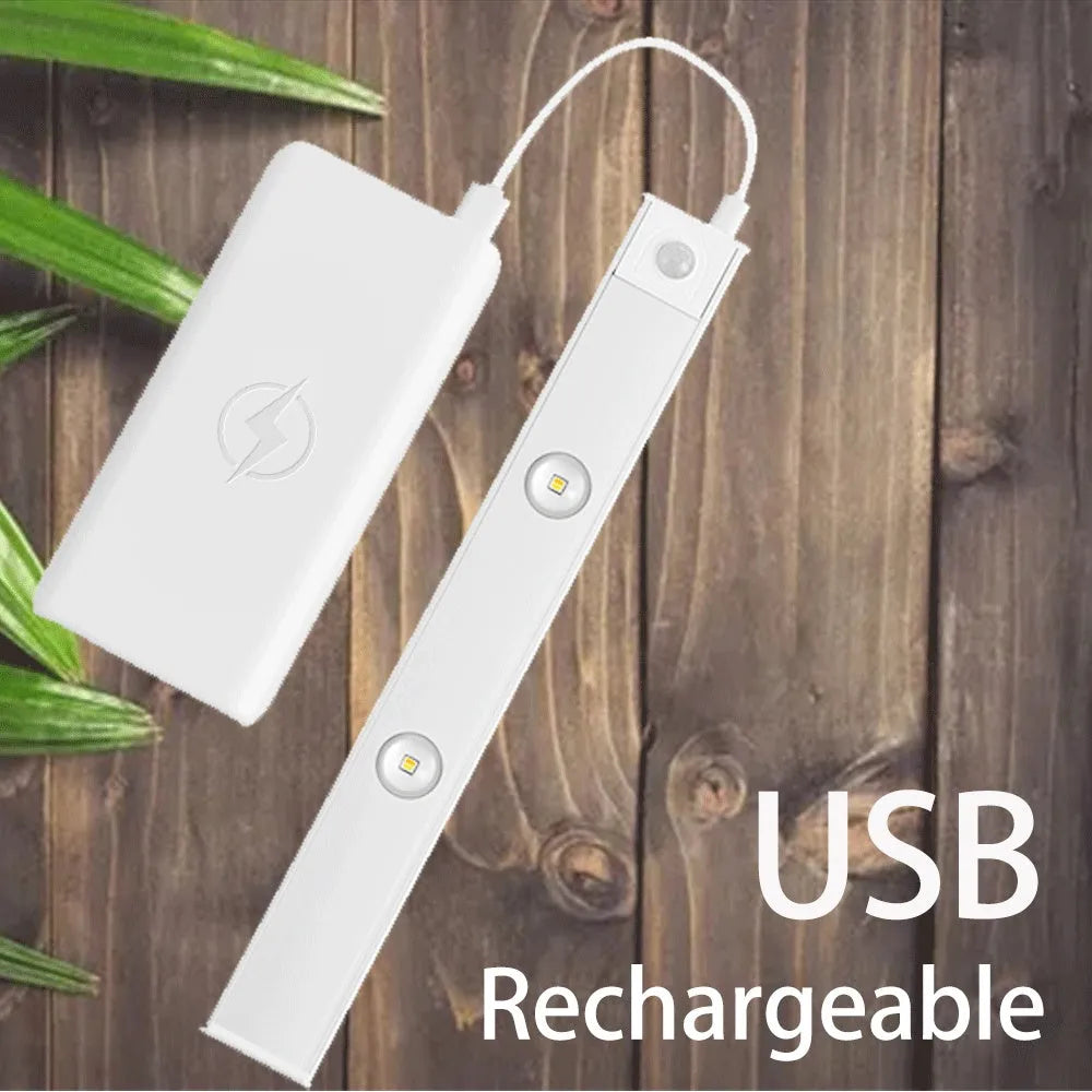 Silver ultra-thin LED light strip with motion sensor mounted inside a wooden wardrobe.