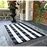 Cotton buffalo plaid rug in classic pattern on a light floor, showing non-slip backing