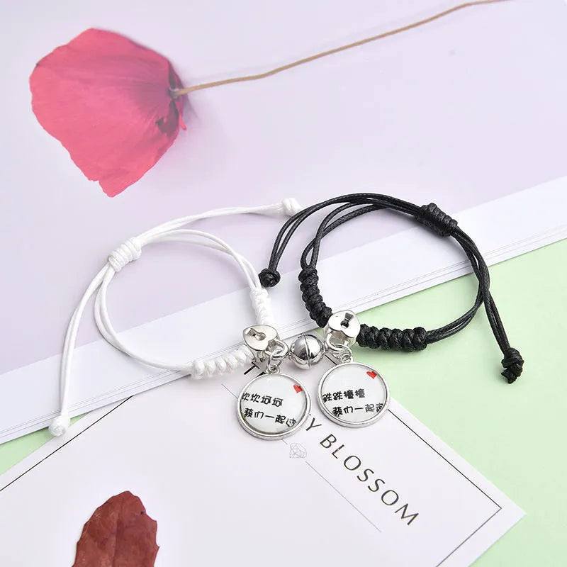 Alloy magnetic suction bracelet pair for couples with symbolic design options