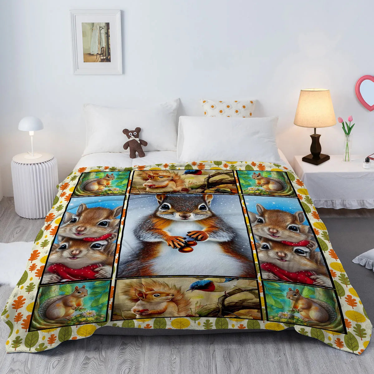 Yellow flannel blanket with white bellied squirrel print, 130x150cm, on a sofa