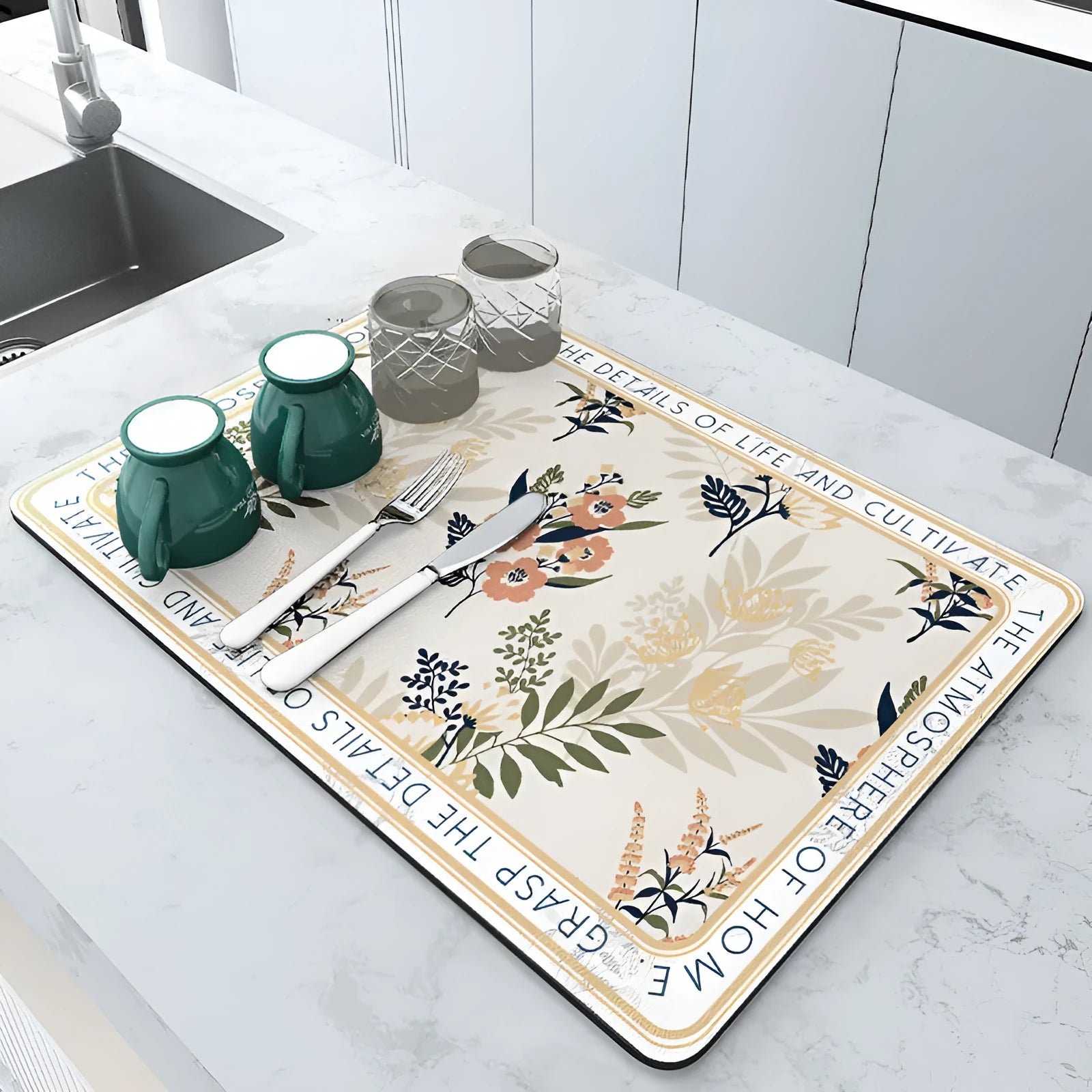 Square diatomite kitchen draining mat in camellia purple on a kitchen worktop, with a teacup resting on it