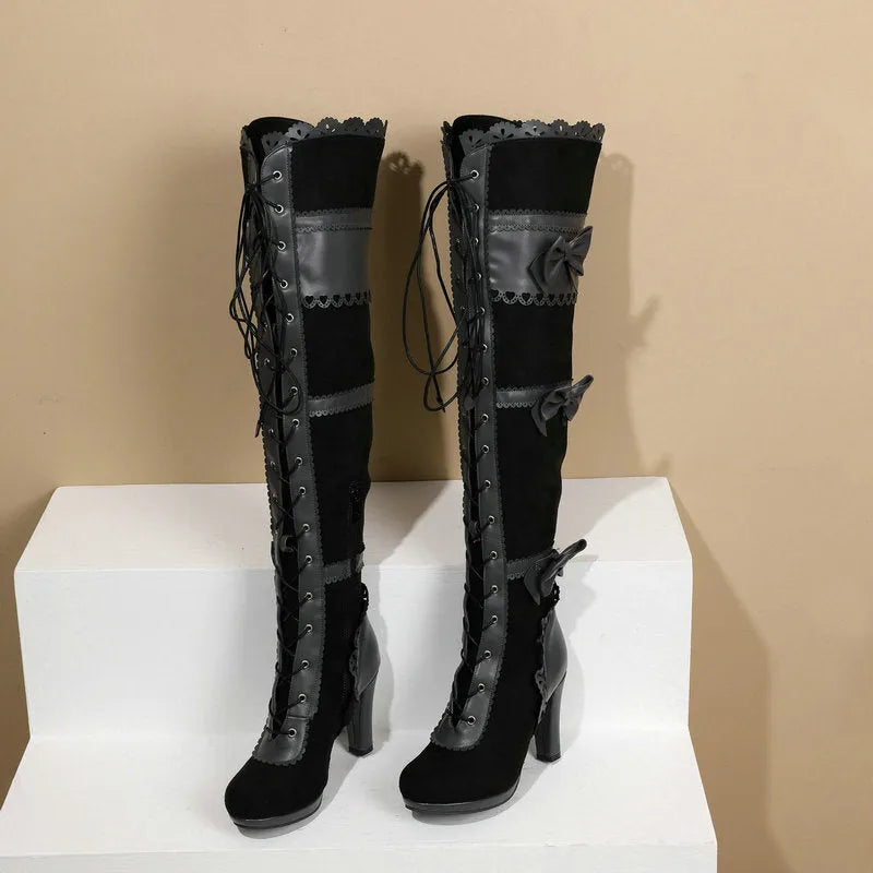 Women's high heel lace strap boots in black artificial PU with round toe and lace-up front