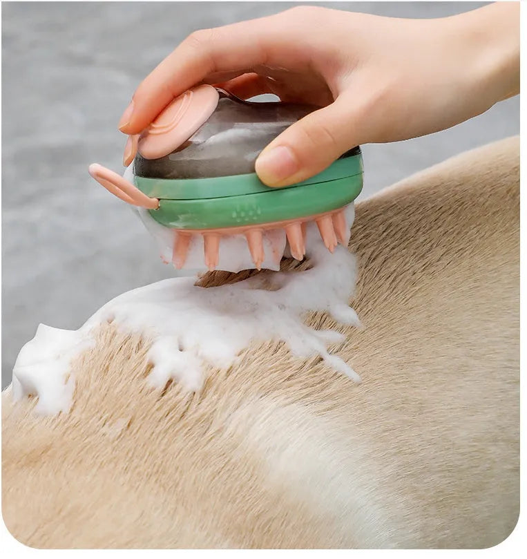 Blue 2-in-1 pet grooming brush with soft silicone bristles and shampoo dispenser on a light background