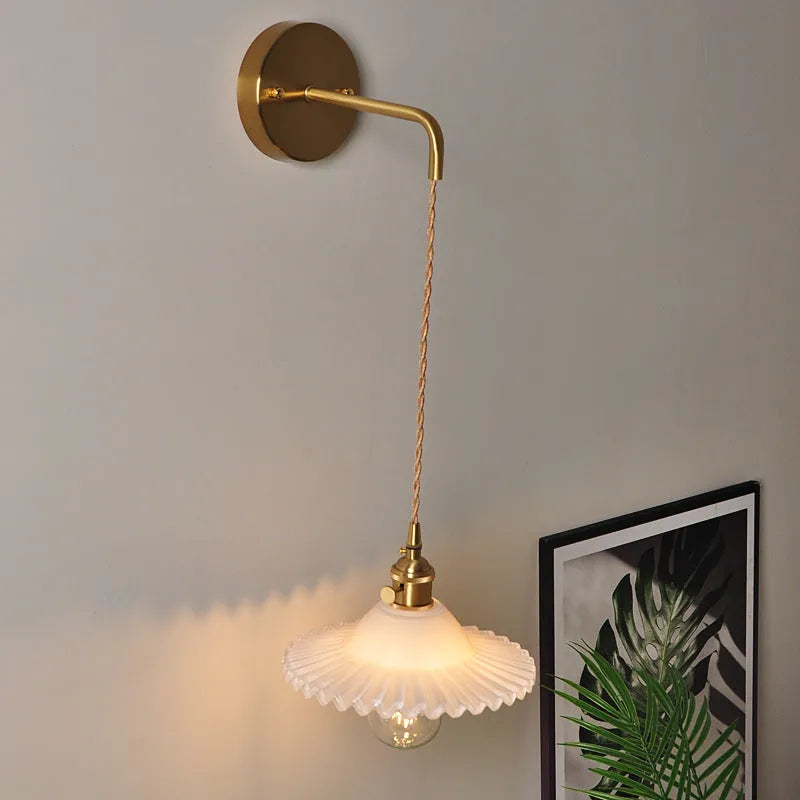 Retro brass wall lamp with a glass lotus shade in a choice of six colours on a copper base.