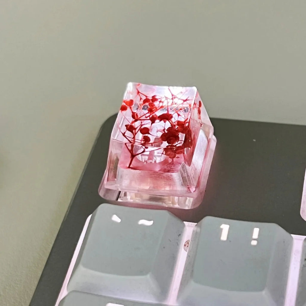 High transparency resin mechanical keyboard keycap with starry sky design in one of four colours.