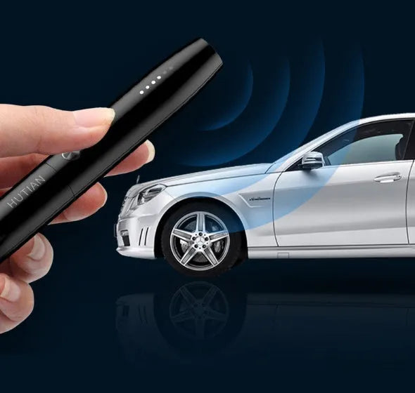 WT09 portable spy gadget detector with antenna, pen-style black body, and signal strength LED indicators on a table