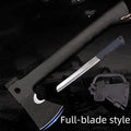 Black survival tactical axe with stainless steel blade and K sheath on outdoor rocky surface