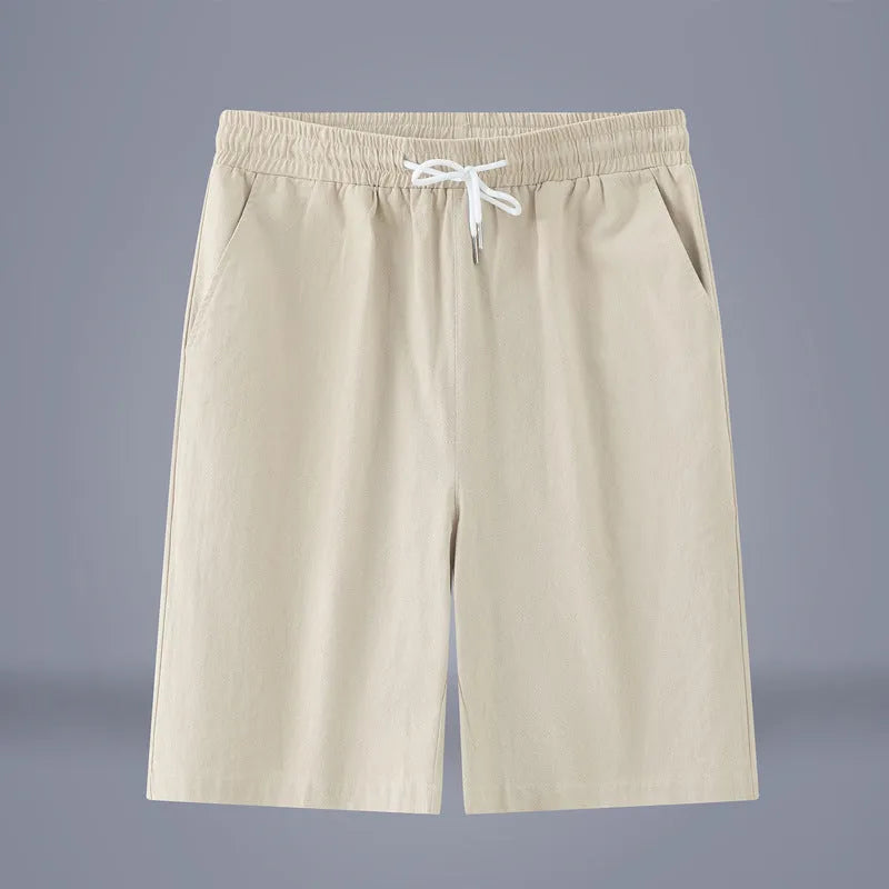 A pair of solid colour cotton linen cropped pants with a drawstring waist, shown in Army Green.
