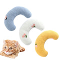 Small blue U-shaped pet pillow with faux fur, showing raised rim and half-donut shape for cats or small dogs.