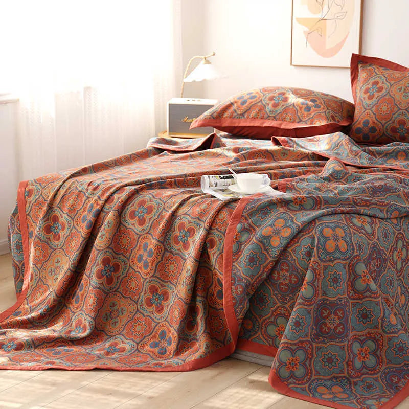 Cotton gauze three-piece blanket set with floral pattern and matching pillowcases for bed