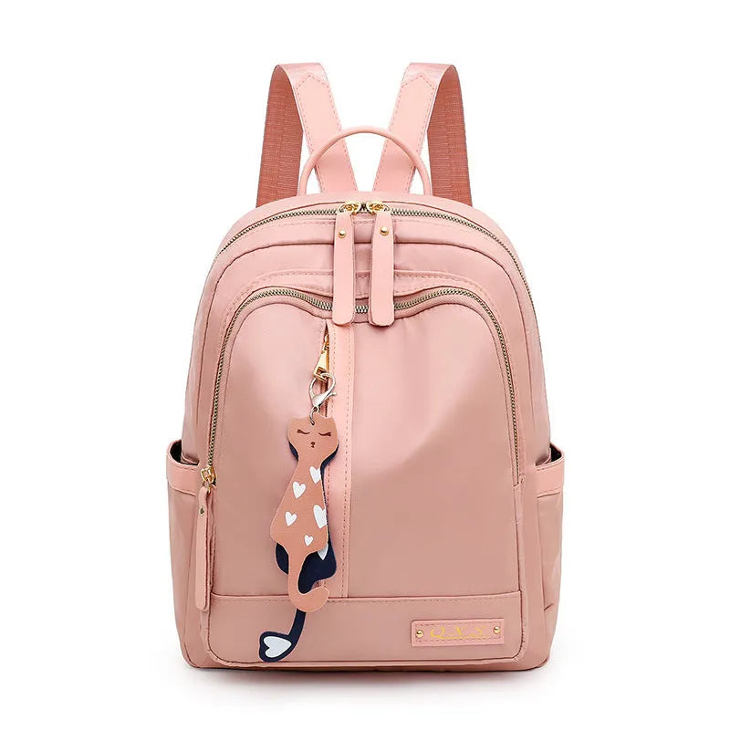 Women's black casual nylon backpack with double shoulder straps showing interior organisation compartments