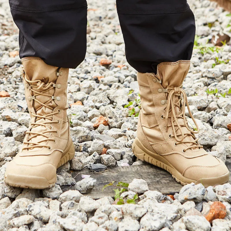 Yulong summer tactical desert combat boots in black and sand colour, shown on a rocky outdoor surface.
