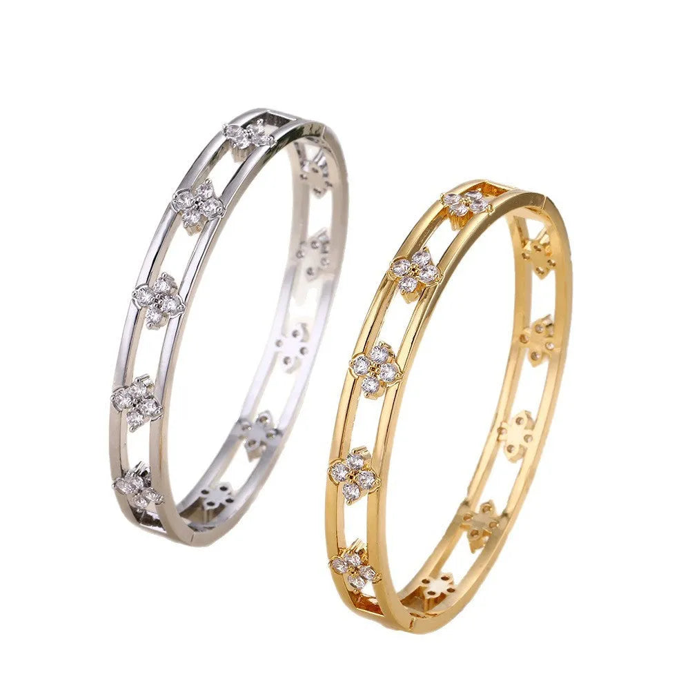 Women's hollow bracelet with four-leaf clover design and inlaid zircon stones
