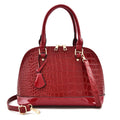 Black shiny PU crossbody bag with shell shape, showing size and polyester lining.