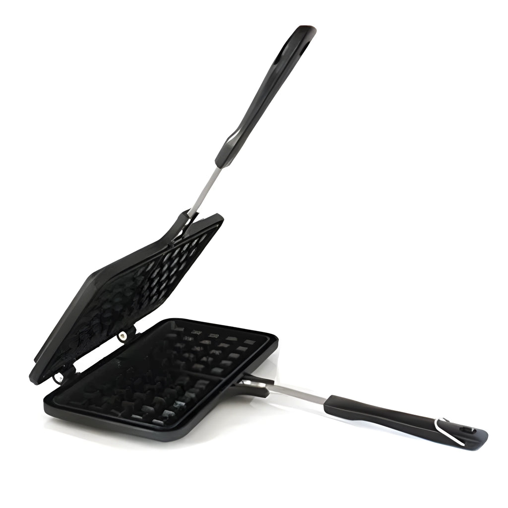 Black non-stick aluminium waffle plaid cake mold with locking handle on gas stove