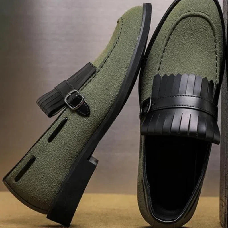 Men's gray denim loafer shoes with tassel accents, pointed toe, flat heel, on a white background