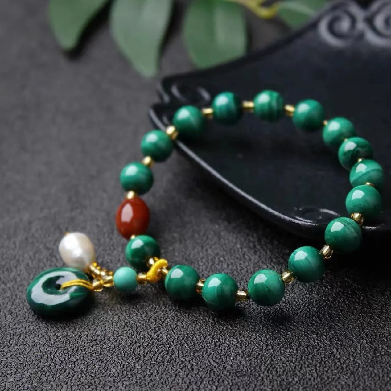 Natural malachite and red agate bracelet with 7-8mm barrel beads on wrist