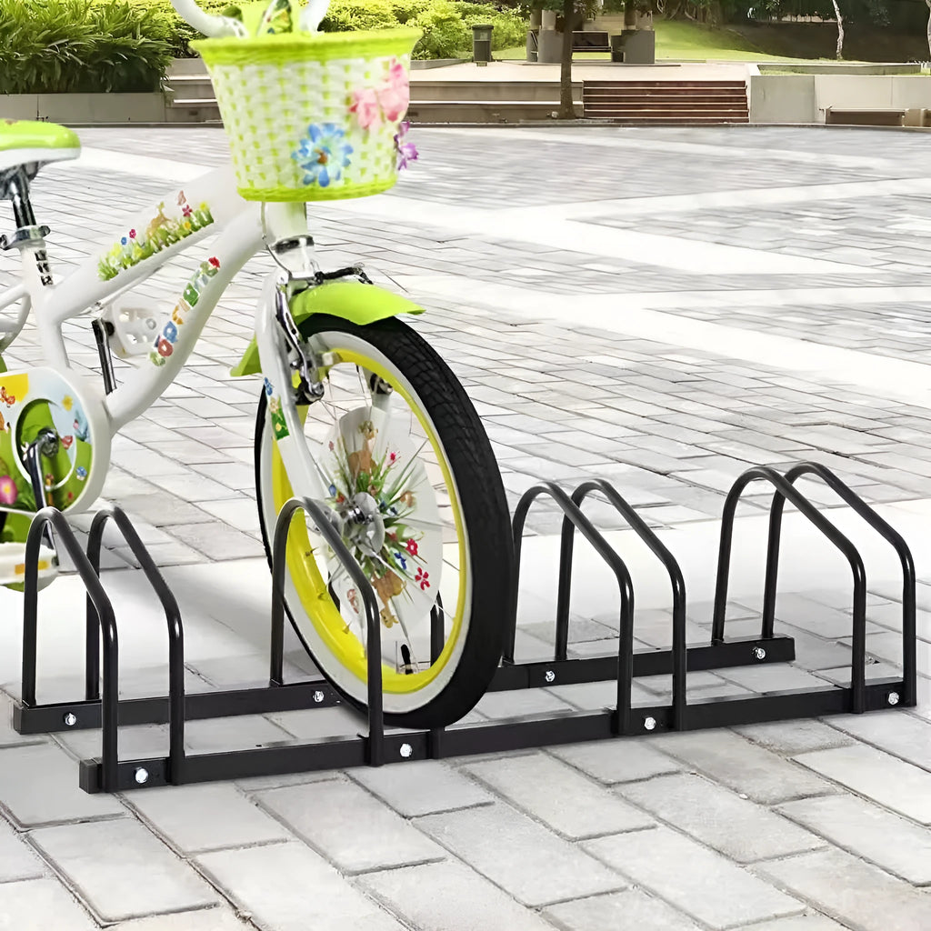 Black metal bicycle parking rack with four card positions holding bicycles upright