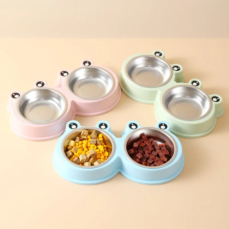 Stainless steel frog-shaped double pet bowl for food and water, available in blue, green, or pink.