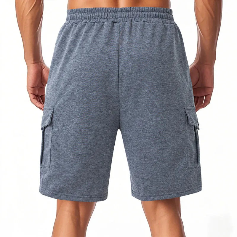 Men's heavy towel fabric cargo shorts with multiple pockets in light grey colour showing elastic waistband and loose fit design