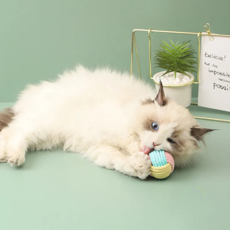 Handmade cat hair ball plush cotton toy in blue powder, green blue, or pink green colours measuring 5cm diameter