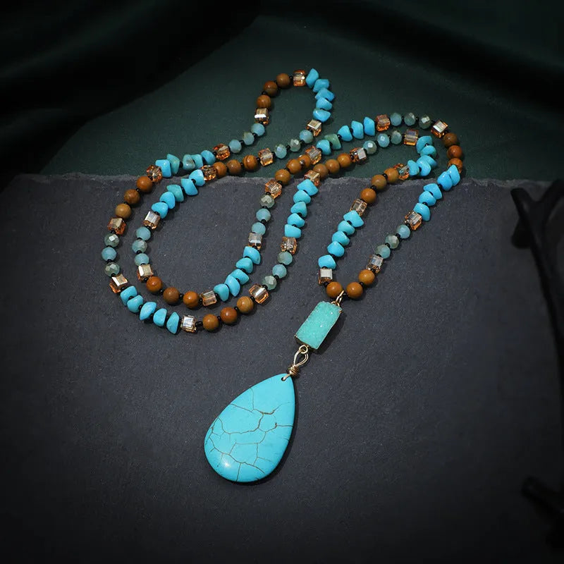 Turquoise blue necklace with water drop shaped pendant on ball bead chain
