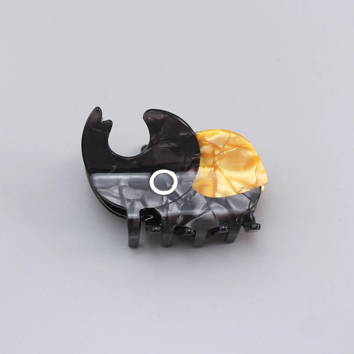 Handmade cellulose acetate beetle grip hair clip with cartoon caterpillar design in green, orange and white colours