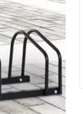 Black metal bicycle parking rack with four card positions holding bicycles upright