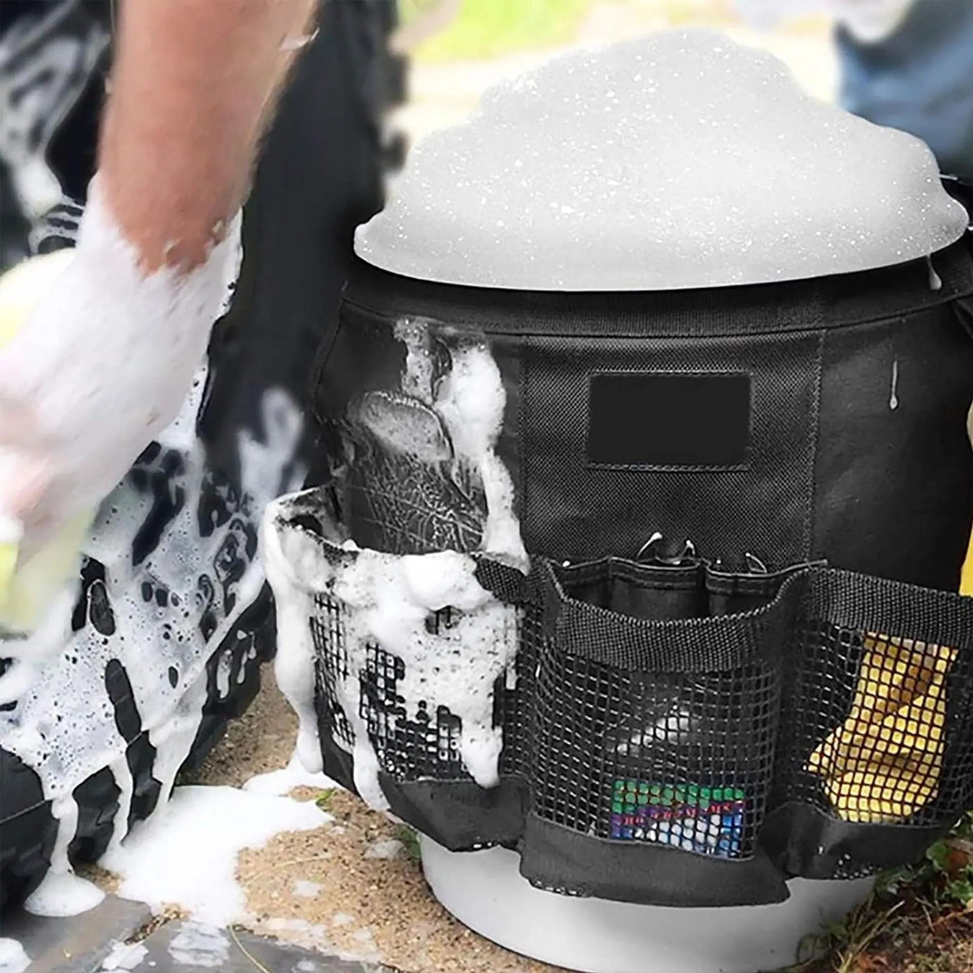 Black polyester bucket storage bag hanging on 5 gallon bucket for tool organisation