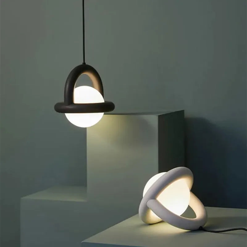 Danish designer Nordic hanging line lamp in green finish beside a bed.