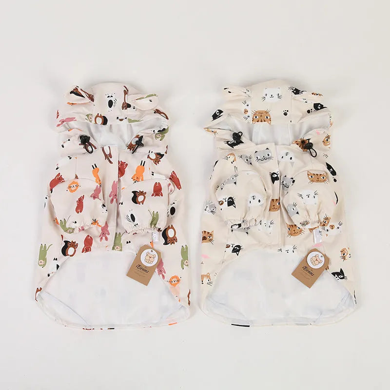 Beige dog raincoat with cartoon small animal print, showing PU waterproof material
