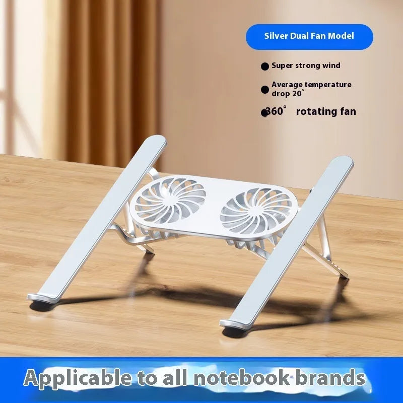 Silver aluminium alloy laptop cooling stand with dual fans in a raised, open position on a desk.