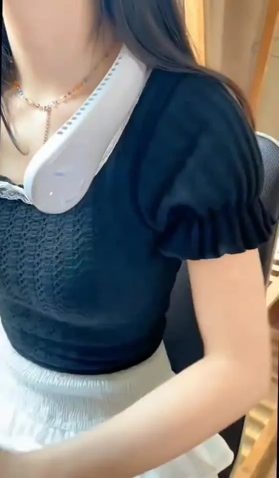 Pink USB rechargeable bladeless neck fan being worn, showing its lightweight and comfortable design.