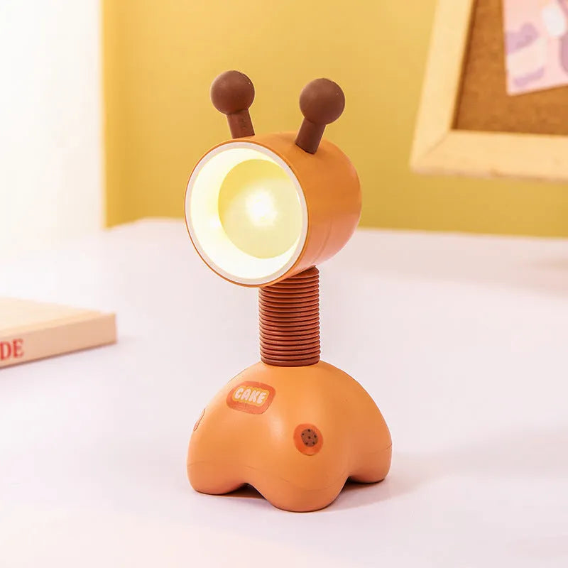 DIY cartoon magnetic small night lamp in assorted animal styles and colours on a desktop.