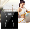 Black digital electronic bathroom scale on a tiled floor showing a weight reading.