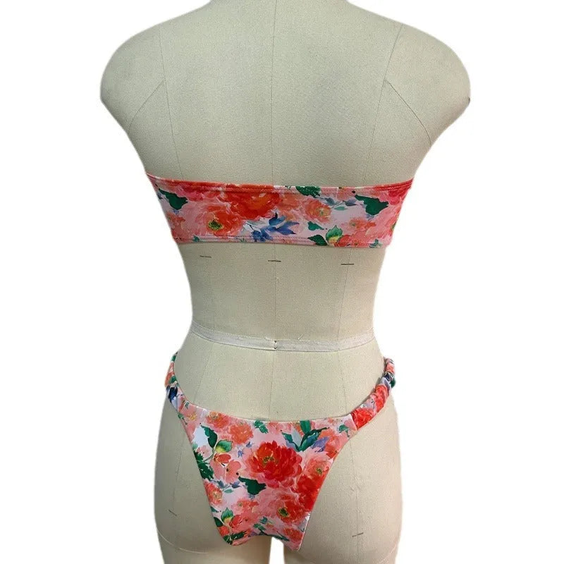 A colourful floral print lace tube top bikini set with matching shorts on a mannequin.