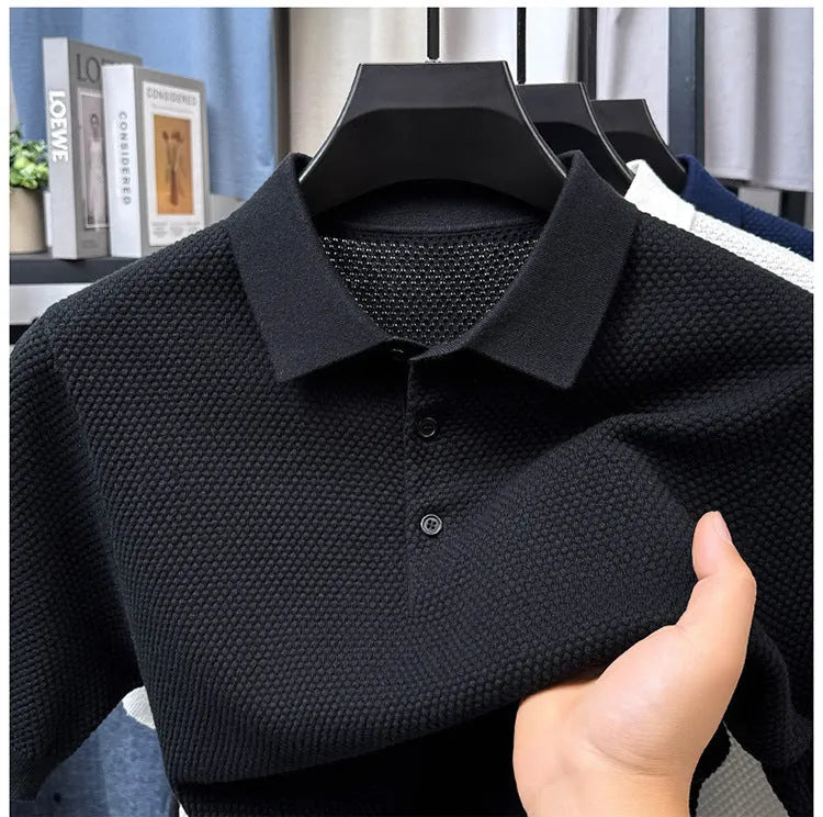 Loose fit grey cotton short sleeve pullover sweater laid flat.
