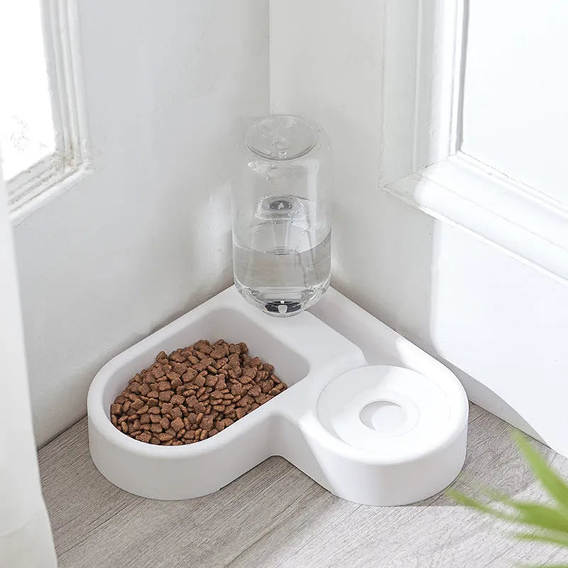 White food-grade plastic pet water fountain for cats and dogs on a countertop.