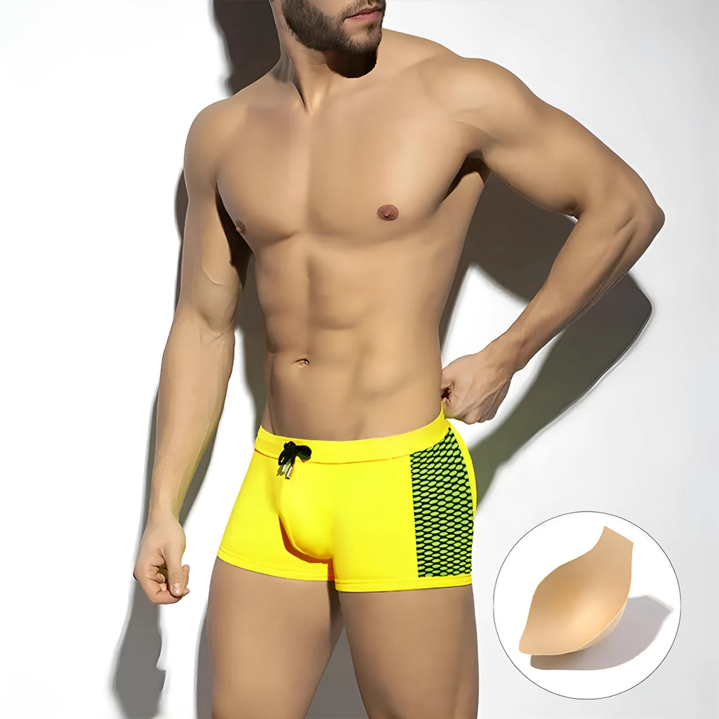 Men's polka dot print swimming boxers in quick-dry nylon fabric on a size chart.