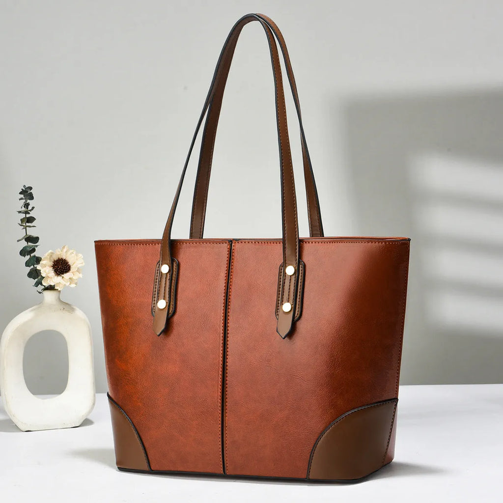 Large horizontal tote bag in beige PU with stitching detail, single shoulder strap, and inner pocket layout