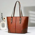 Large horizontal tote bag in beige PU with stitching detail, single shoulder strap, and inner pocket layout