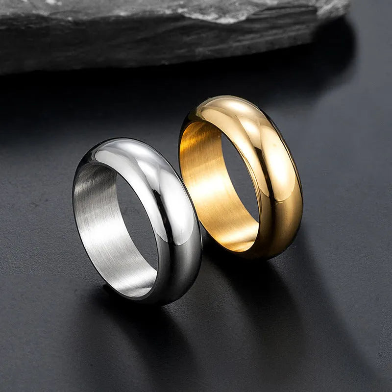 Glossy electroplated titanium steel ring in gold, black, and steel colour showing size range 7-12
