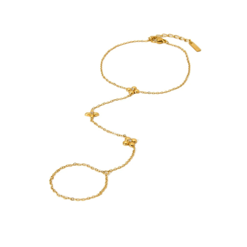 Gold stainless steel bracelet with eight pointed star and flower charms