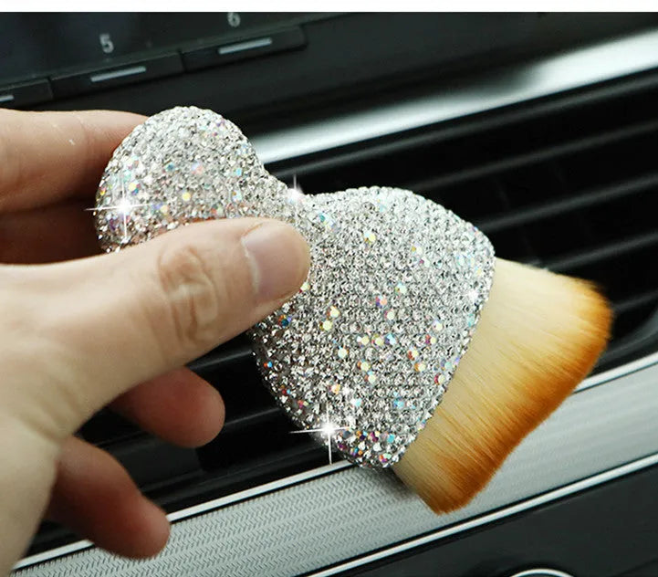 White PVC car interior cleaning brush on a car dashboard, showing its compact size and soft bristles.