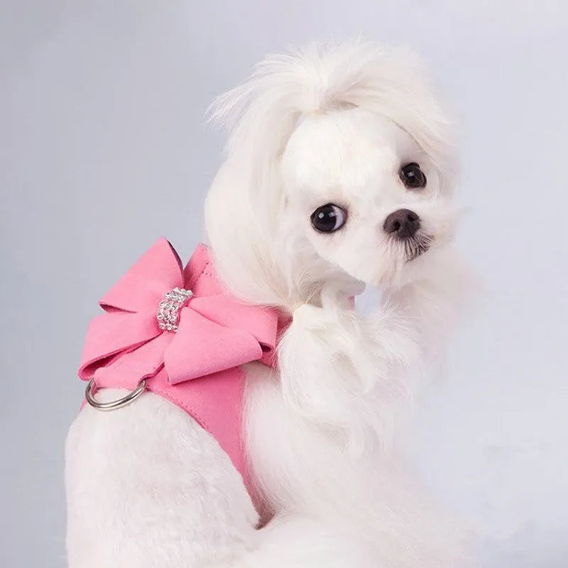 A soft microfiber dog chest strap with a decorative bowknot, shown in pink, blue, and orange colour options.