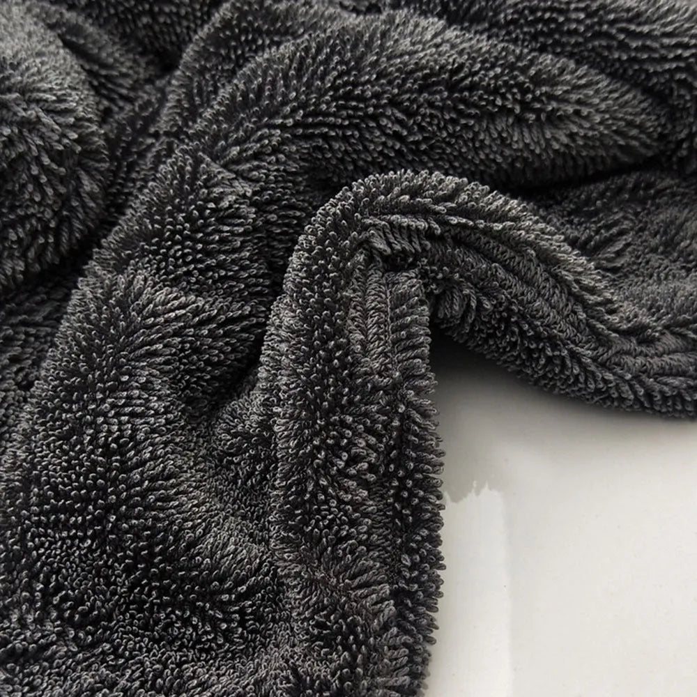 Grey 40x40cm square microfiber car wash and drying towel laid flat.