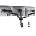 Black three-arm gas spring monitor mount holding a 27-inch screen above a desk.